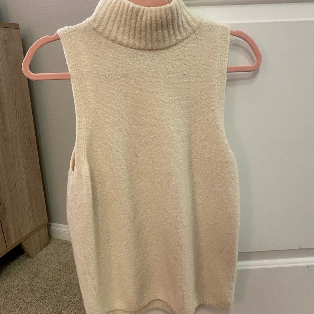 Sleeveless cream turtleneck tank top